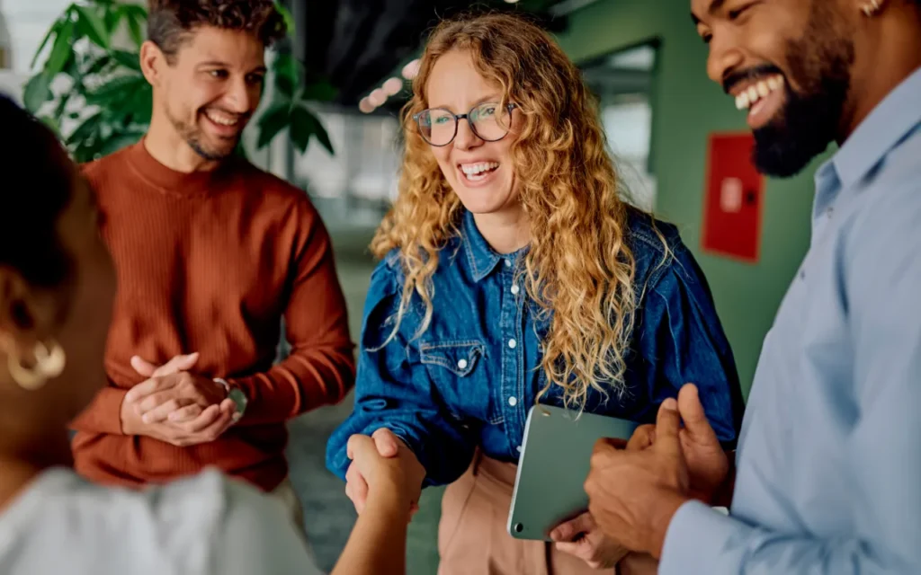 Woman shaking hands with her team