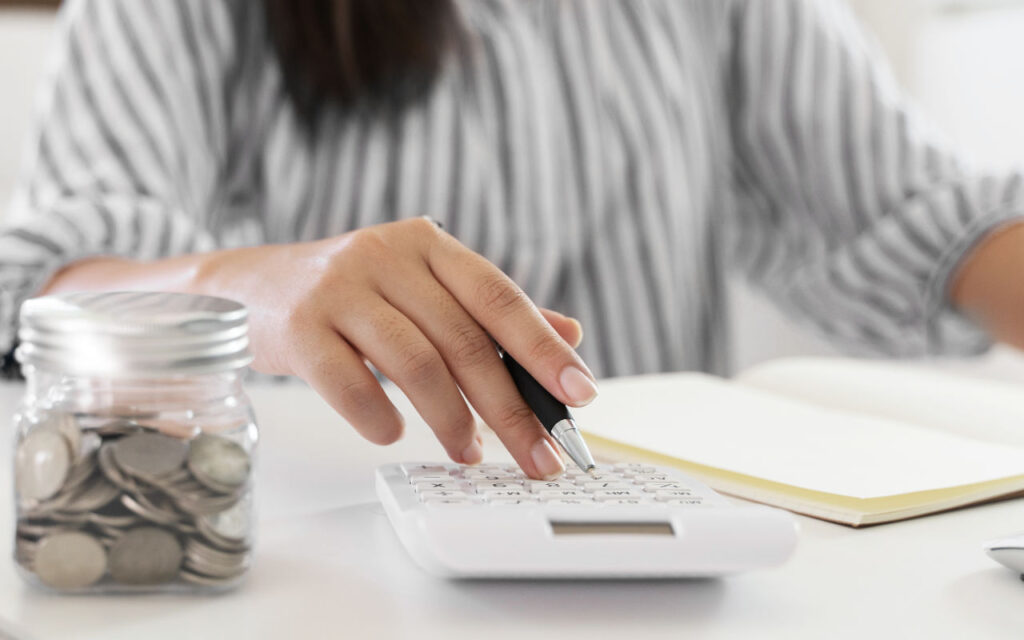 A woman using a calculator