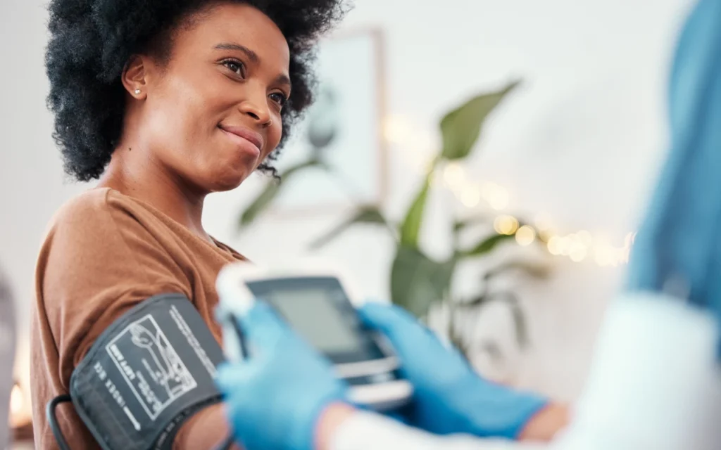 A woman has her blood pressure checked on know your numbers awareness day