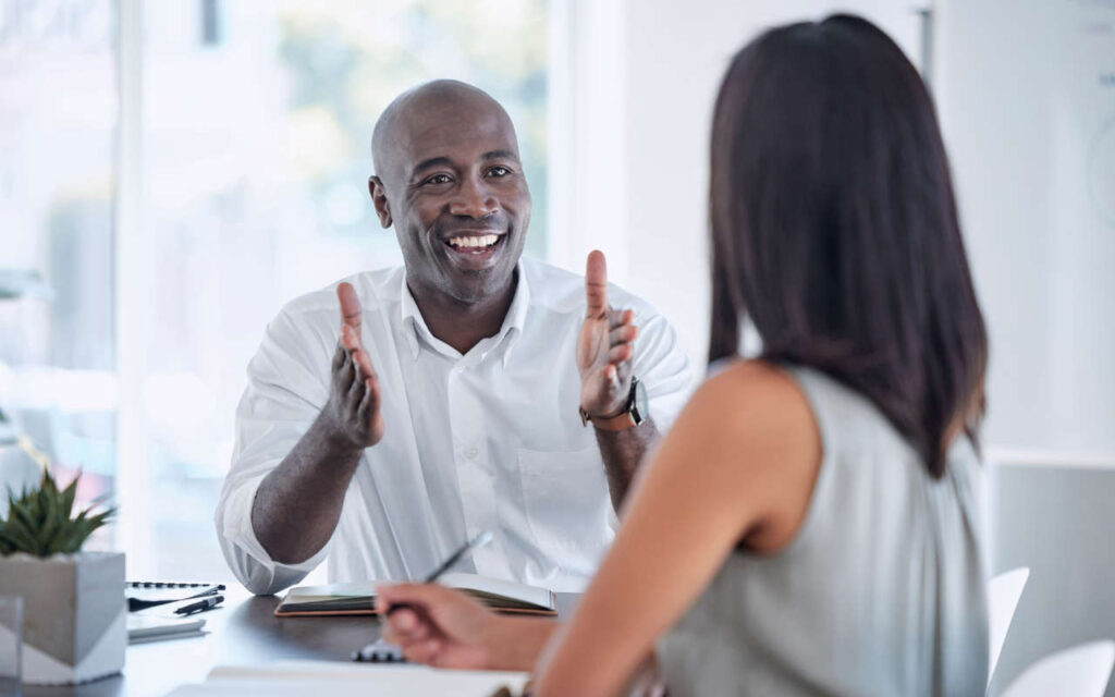 man smiling at woman