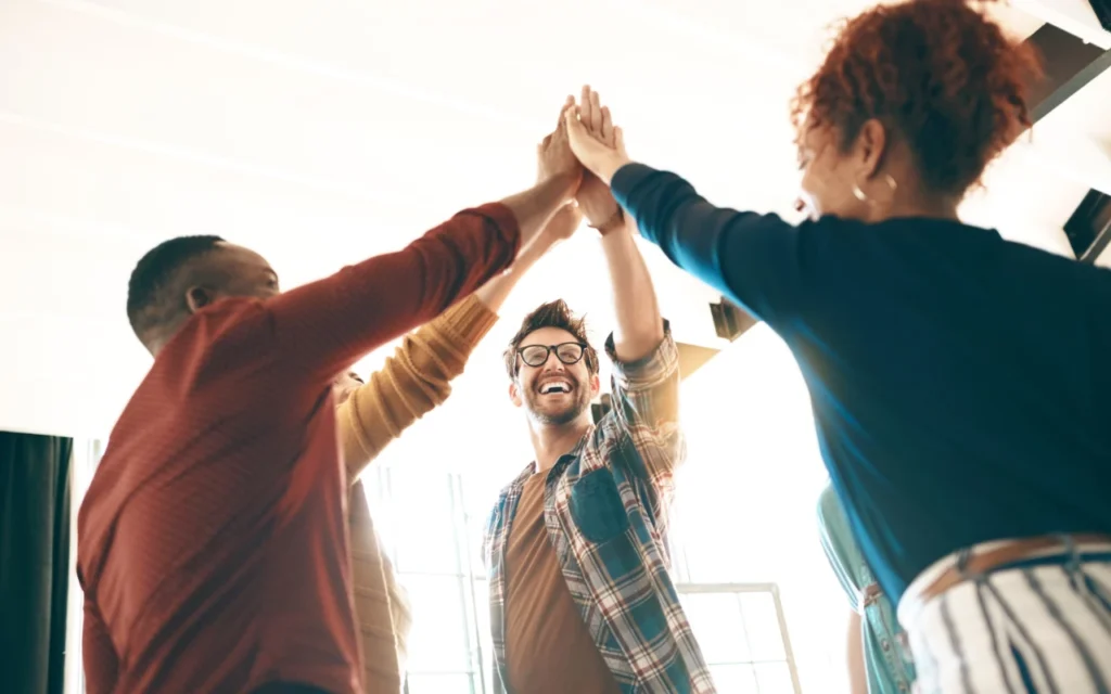 lots of colleagues high-fiving as they realise that personalisation is the key to benefit engagement