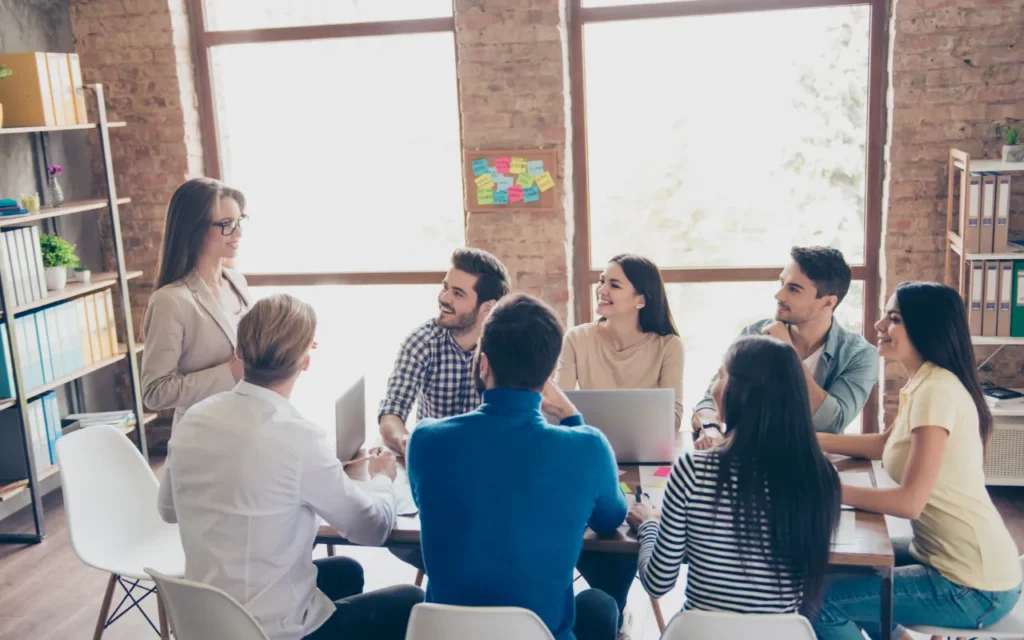 A team sitting watching a presentation